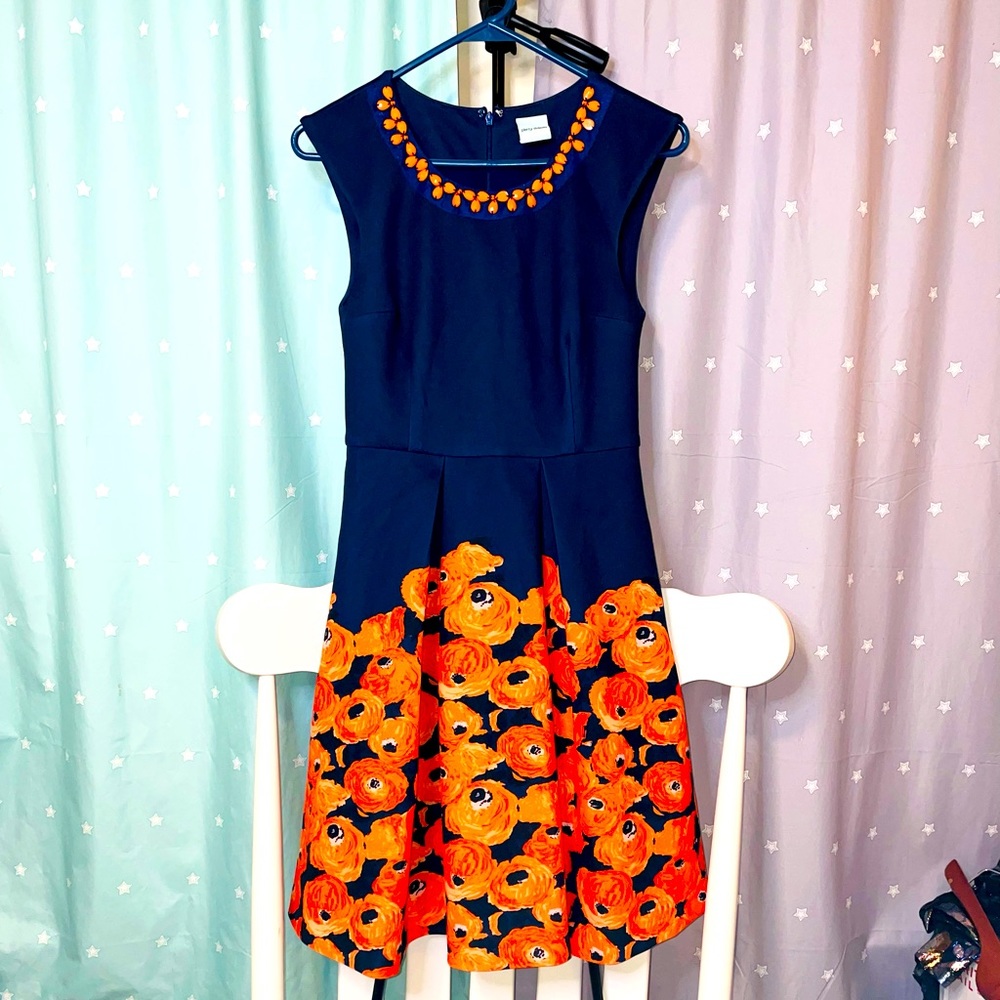 Plenty by Tracy Reese knee length sleeveless navy dress with orange “necklace”
